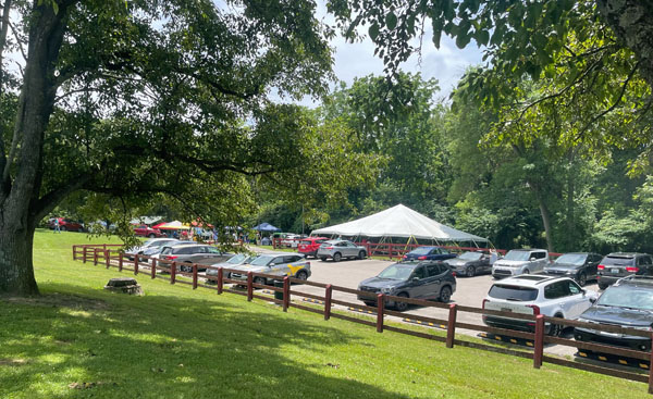 Boone Woods main parking lot with tents in background
